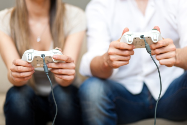 Man and woman playing video game
