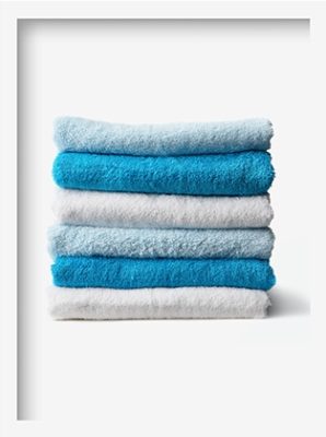 bathroom towels folded in a pile
