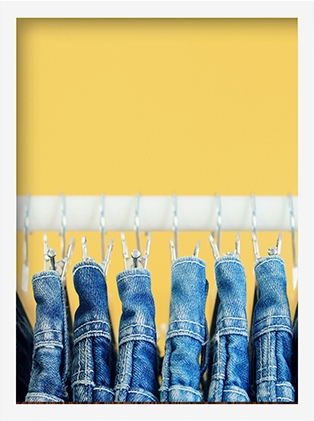 jeans hanging in a closet