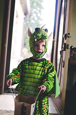 kid in dragon costume