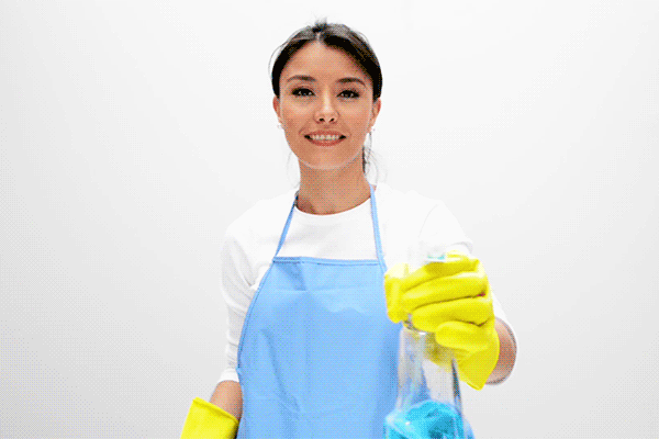 woman cleaning with spray bottle