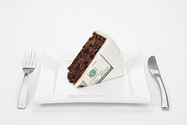 cake slice with $100 bill lasered in icing