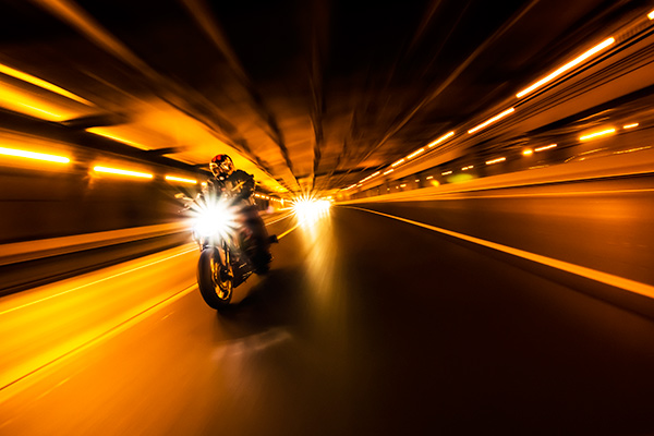 motorcycle riding through tunnel