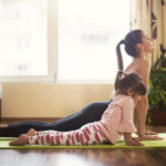 Full length shot of a mother and daughter doing yoga together
