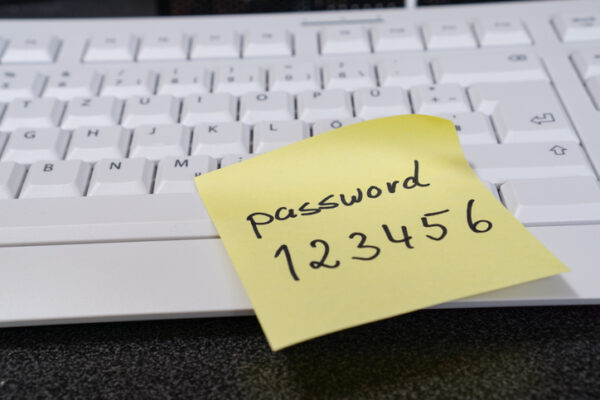 Note with the word password on a computer keyboard