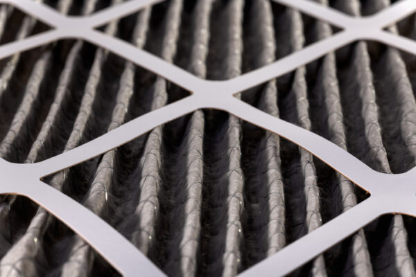 Close up of home air filter showing the dirt and particle cause bacteria inflection and sickness.