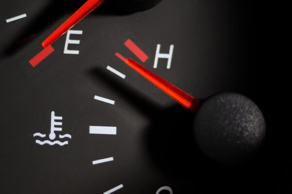 Car engine temperature sensor close up arrows