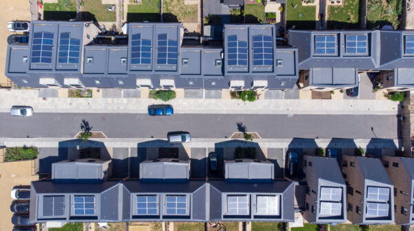 Overhead aerial view of a newly built housing development with solar panels installed in all the homes helping to aid sustainable living.