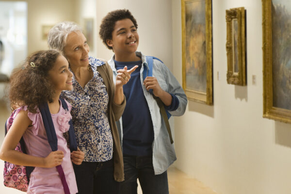 Grandmother and grandchildren visiting a museum