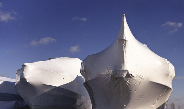 winter storage for the yachts,all covered in plastic wraps and mounted on the stands