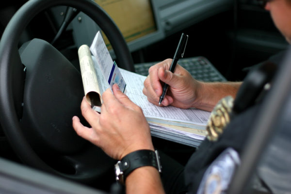 Police officer writing ticket