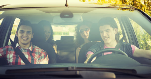 Group of teens inside a car