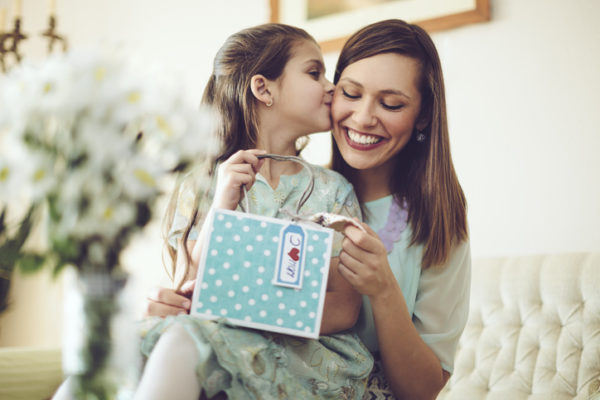 Happy mother posing with her daughter