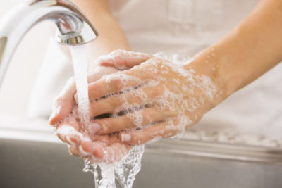 Caucasian woman washing her hands