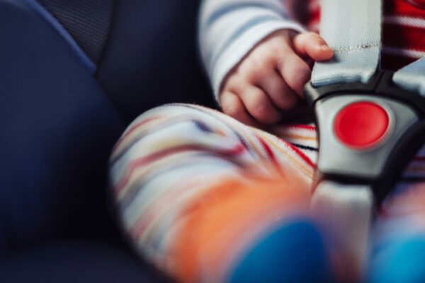 Baby in car seat, close up.