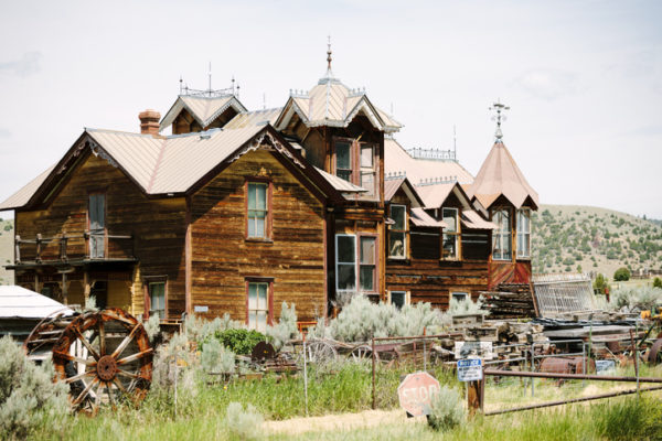 An abandoned house and waterwheel, Virginia City, Montana, USA.