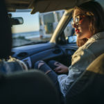 Young women traveling in a car.Seen from the inside.