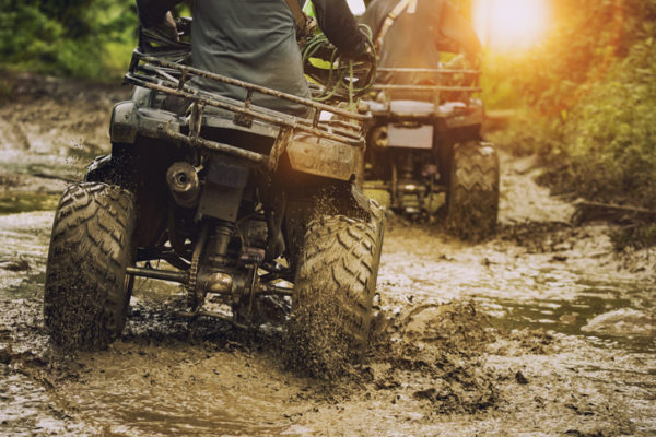 man riding atv vehicle on off road track ,people outdoor sport activitiies theme