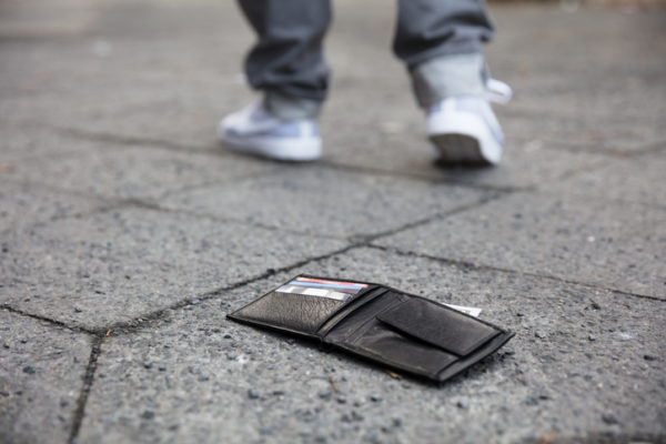 Man Walking After Losing His Wallet On Street