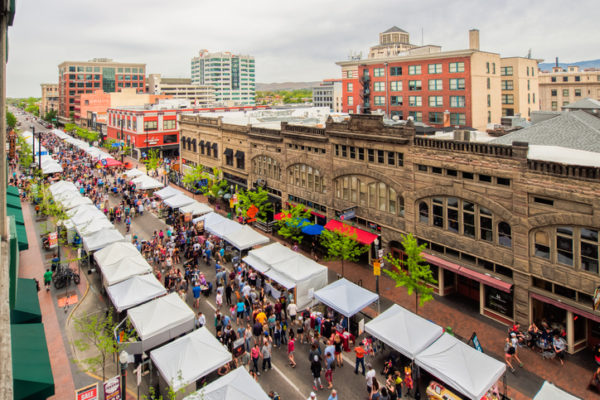 Boise, ID, USA - May 5, 2018: Bird's eye view of stalls and visitors along the street in the downtown area during Boise Farmers Market weekend in the late spring