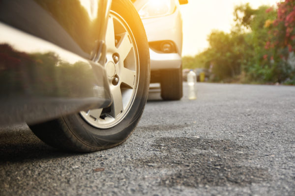 Close-Up Of Car Parked On Road