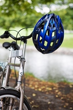bicycle with helmet hanging from handlebars