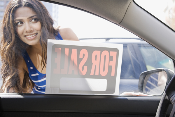 Woman shopping for used car