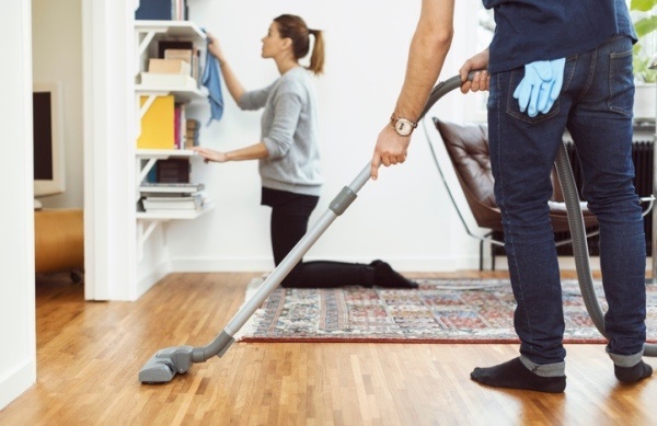 young couple cleaning house