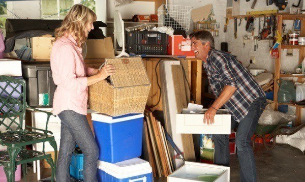 couple clearing out garage for yard sale